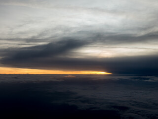 Naklejka na ściany i meble Sunrise view to sky and clouds from high altitude