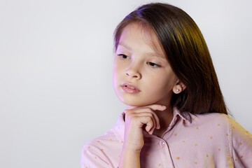 thoughtful little child girl on white background.