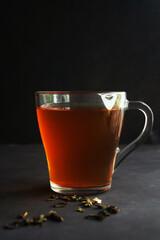 Black loose leaf tea on dark background