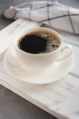 coffee cup on white board near the window