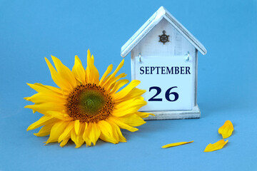 Calendar for September 26 : decorative house with the name of the month in English, number 26,...