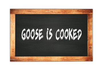 GOOSE  IS  COOKED text written on wooden frame school blackboard.