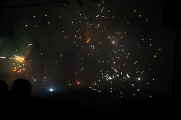 Colored sparks produced by demons during the festivities of Mallorca. Concept: Celebration of the festivities of the demons and the fireworks of the correfocs, Palma de Mallorca, Maria de la Salut © DarwinDSBNewYorkcity
