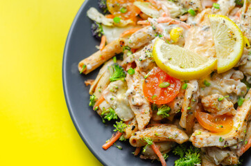 Piri piri style chicken on a bed of wholewheat pasta and vegetables, with a cool sour cream and chive dressing