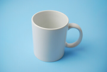 White ceramic cup mock up for coffee or tea logotype and branding. 
