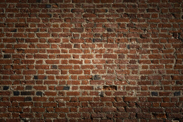 creative background from an old brick wall. artistic backdrop with vignette for moody decoration