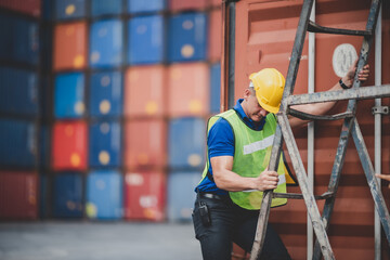 foreman or engineer are work in container shipping industry warehouse, logistic transport to import and export cargo at delivery storage port terminal, man are work to control a business box