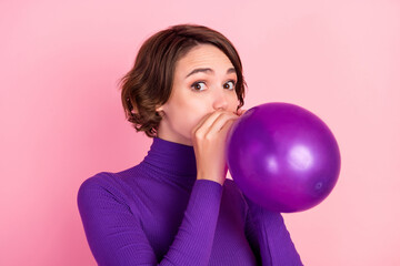 Photo of nice brunette millennial lady blow balloon wear violet turtleneck isolated on pink background