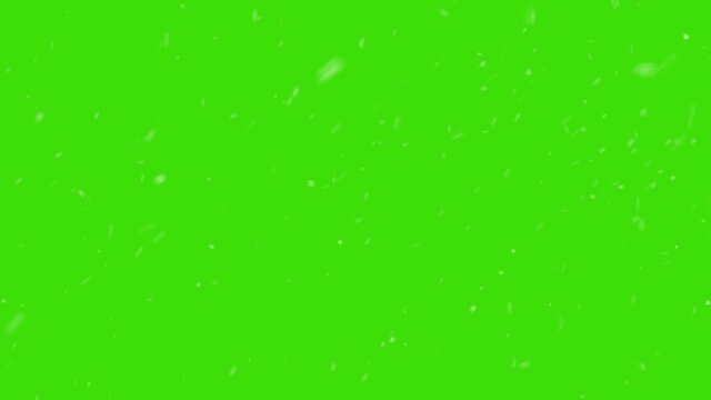 A dense heavy blizzard snowstorm VFX insert in slow-motion on green screen. Black screen Christmas snowstorm. Particles swirling moved by wind. More elements in our portfolio