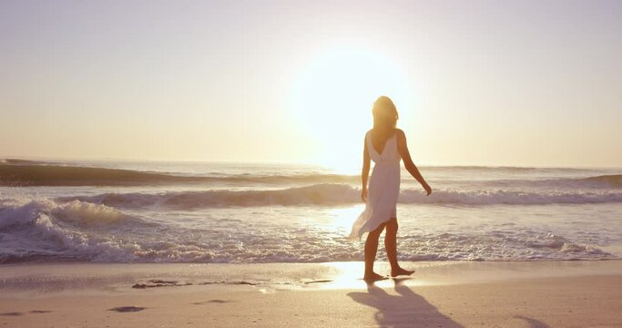 Free happy woman spinning arms outstretched enjoying natural  lifestyle dancing on beach at sunset slow motion RED DRAGON
