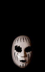 Front view of a white mask with black background with copy space