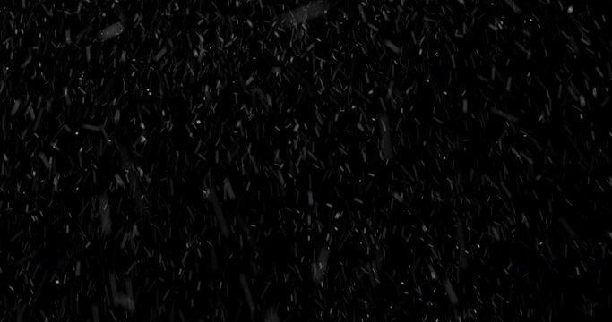 Falling white snow on a black background, realistic in 4K resolution, looped, seamless has no beginning and end. Volumetric falling snowflakes in space