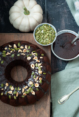 Pumpkin chocolate cake with chocolate sauce and pumpkin seeds
