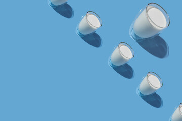 World Milk Day. Pattern on a blue background. A glass of milk. Pattern.