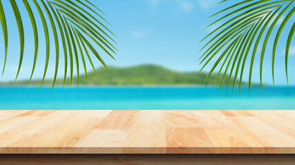 Wood table against scenic view of the sea and blue sky. For your product placement or montage with focus to the table top in the foreground