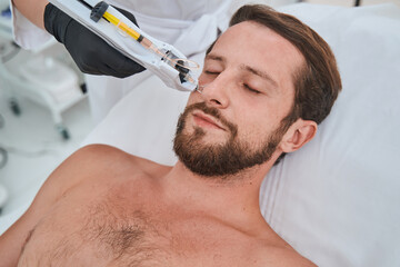 Young spa client undergoing a mesotherapy treatment