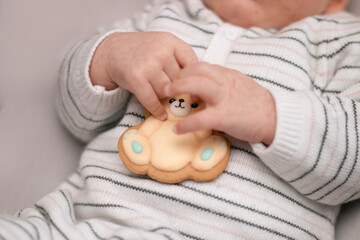closeup baby gingerbread, child holding gingerbread in hand