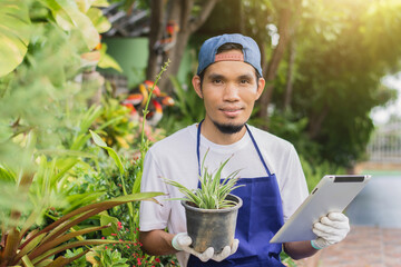 Asian man owner shop small business sale gardening online