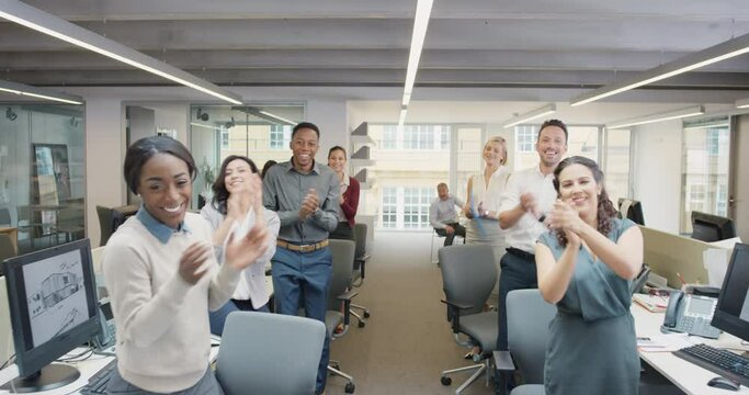 Congratulations businessman receiving praise as team members clap in applause celebrating victory on return to office slow motion walk POV shot concept series
