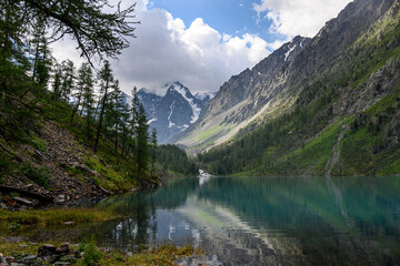 Fototapeta na wymiar Blue water of a mountain lake. Beautiful mountain landscape. Shavlinsky lakes, Altai. 