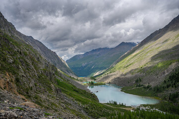 Blue water of a mountain lake. Beautiful mountain landscape. Shavlinsky lakes, Altai.
