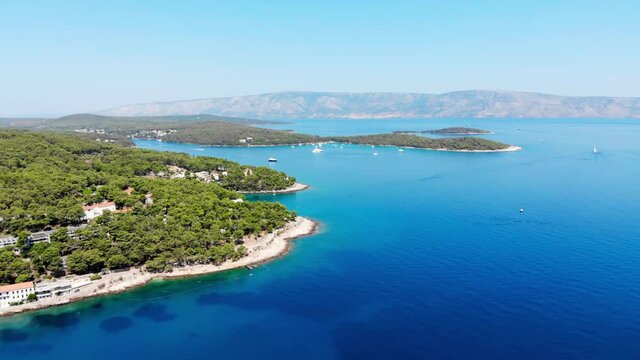 Drone shot on boat trips to the nearby Paklinsky Islands. Secluded beaches and coves in Croatian island of Hvar. Dubovitsa, and lavender fields frame from drone. Drone shot on Croatian island