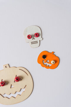 halloween pumpkins and skulls with beady eyes