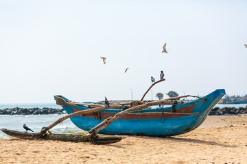 Wooden fishing boat on the ocean. Fishing village on the island