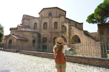 Beautiful tourist girl visiting the Basilica of San Vitale in Ravenna, Italy