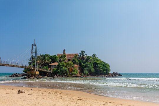A small island near the beach by the ocean