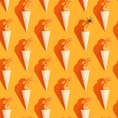 small pumpkin and spider in a ice cream cone