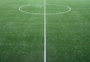 The geometric shapes drawn by the white lines of a football field.