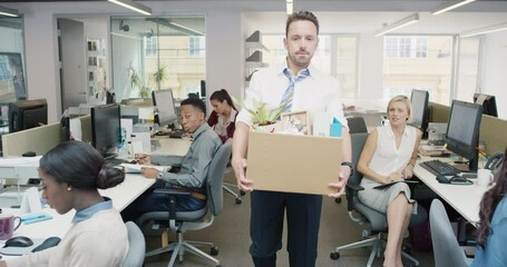 Businessman getting fired carrying box of personal belongings being made redundant in recession sad worried failure