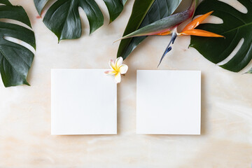 Styled summer wedding desktop stationery mockup. Blank greeting and invitation card. Green tropical leaves with empty space.