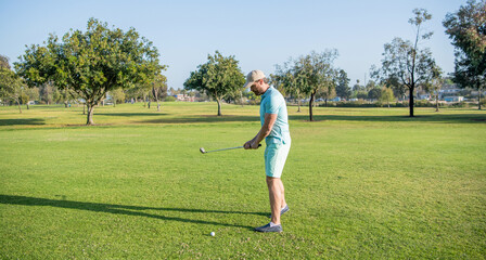 man playing golf game on green grass, sport