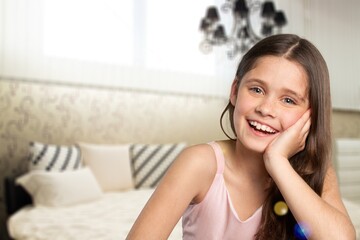 Cute little girl posing on a background