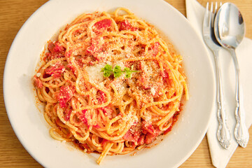 Spaghetti with tomato sauce on plate top view