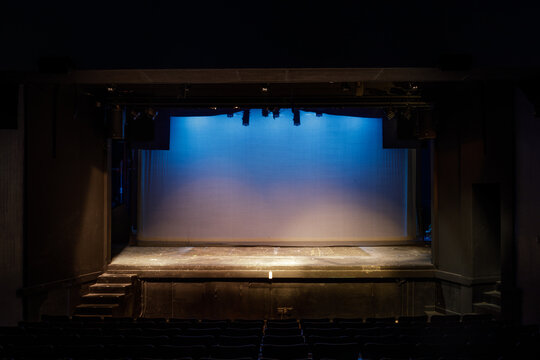 Empty Stage Lit In Blue And Yellow Lights On Cyclorama