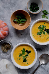 Pumpkin soup made from fresh orange butternut with coconut milk. Delicious vegan, seasonal autumn food.