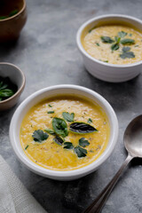Pumpkin soup made from fresh orange butternut with coconut milk. Delicious vegan, seasonal autumn food.