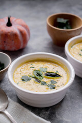 Pumpkin soup made from fresh orange butternut with coconut milk. Delicious vegan, seasonal autumn food.