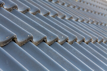 Selective closeup of gray roof tiles