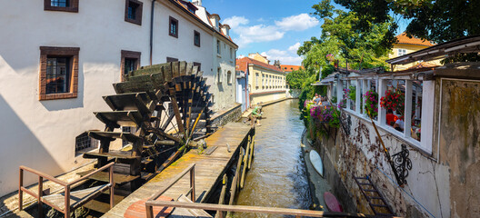 Velkoprevorsky Watermill - mill wheel on the Vltava River, water canal Certovka, Prague, Czech...