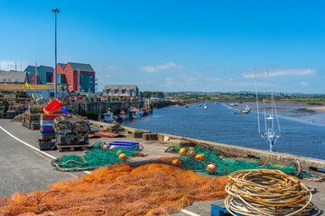 View of fishing nets on quayside and River Coquet at Amble, Morpeth, Northumberland