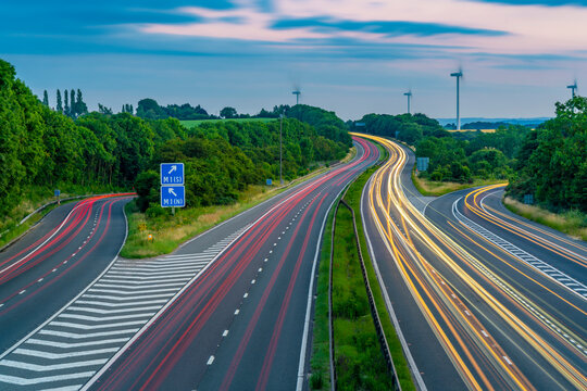 View of trail lights on the intersection of M1 and M18 Motorways at dusk in South Yorkshire, Sheffield