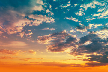 Naklejka na ściany i meble Colorful cloudy sky at sunset. Gradient color. Sky texture. Abstract nature background
