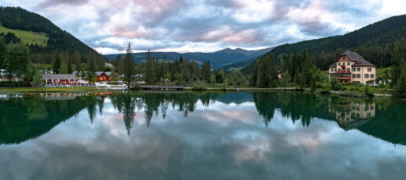 Panoramic of lake Dobbiaco at sunset in summer, Dobbiaco (Toblach), Dolomites, Bolzano province, South Tyrol