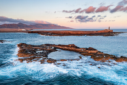 Crashing waves in the rough sea at Punta Jandia lighthouse (Faro de la Lola), Fuerteventura, Canary Islands