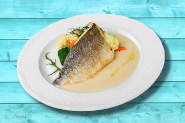 Traditional food tasty fish with vegetables on a plate