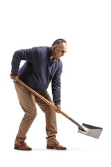 Mature man in casual clothes digging with a shovel